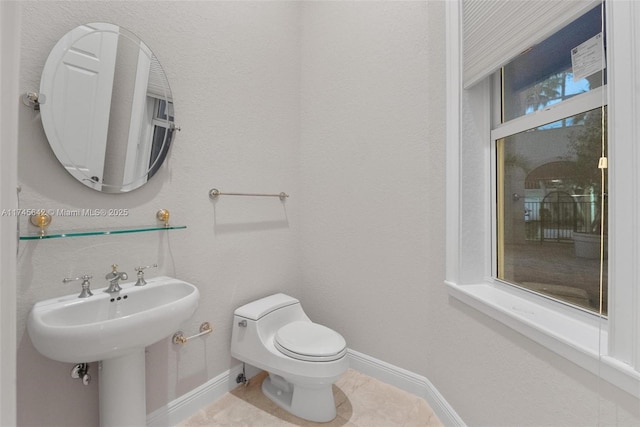 bathroom featuring sink and toilet