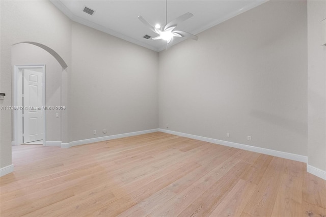 empty room with ceiling fan and light wood-type flooring