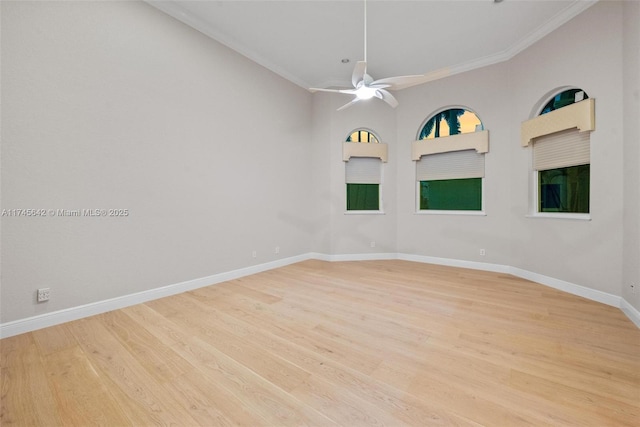 spare room with crown molding, ceiling fan, and light wood-type flooring