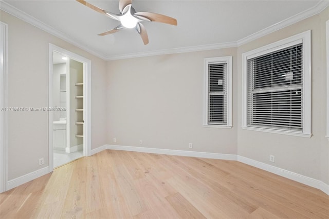 empty room with ceiling fan, ornamental molding, and light hardwood / wood-style floors