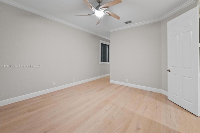 spare room with crown molding, ceiling fan, and light hardwood / wood-style floors