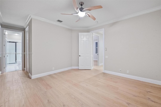 empty room with crown molding, ceiling fan, and light wood-type flooring