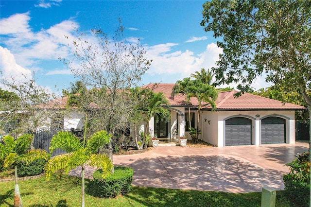 mediterranean / spanish house with a garage