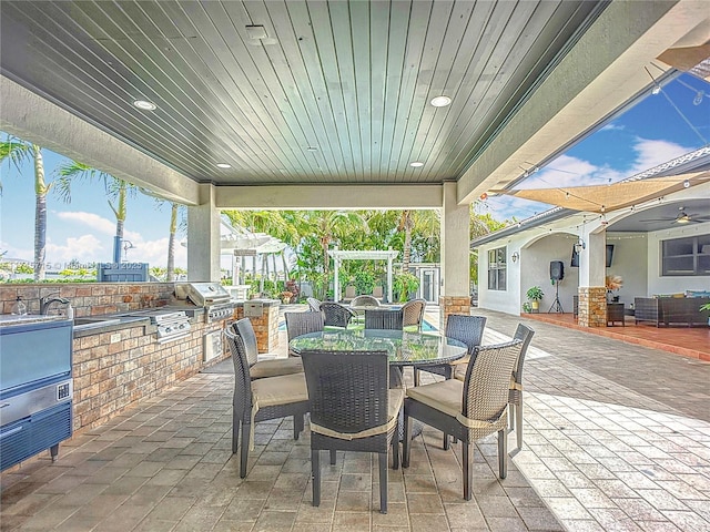 view of patio / terrace featuring area for grilling and a pergola