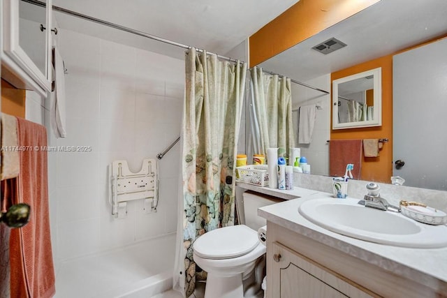 bathroom with vanity, toilet, and a shower with shower curtain