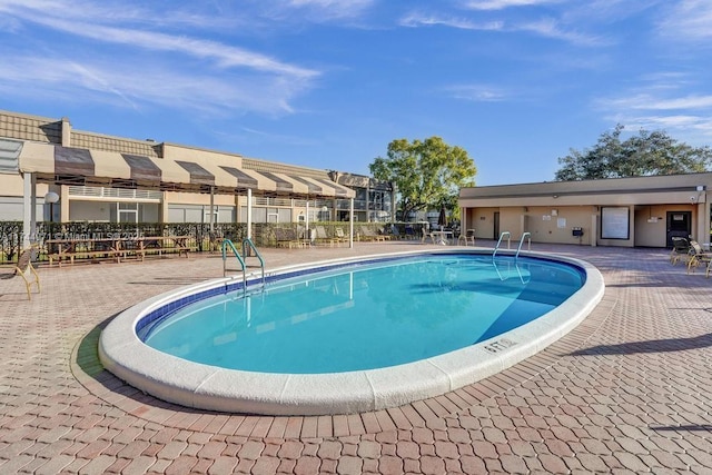 view of swimming pool featuring a patio