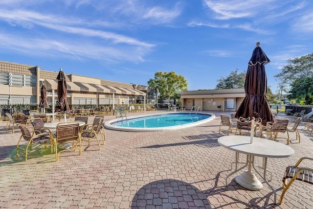 view of swimming pool with a patio area