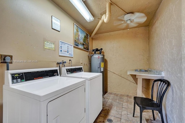 clothes washing area with ceiling fan, electric water heater, and washing machine and clothes dryer