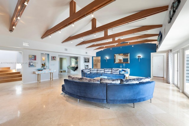 1500 NE 103rd St, Miami Shores, FL 33138 - living area featuring track lighting, beamed ceiling, stairway, high vaulted ceiling, and baseboards
