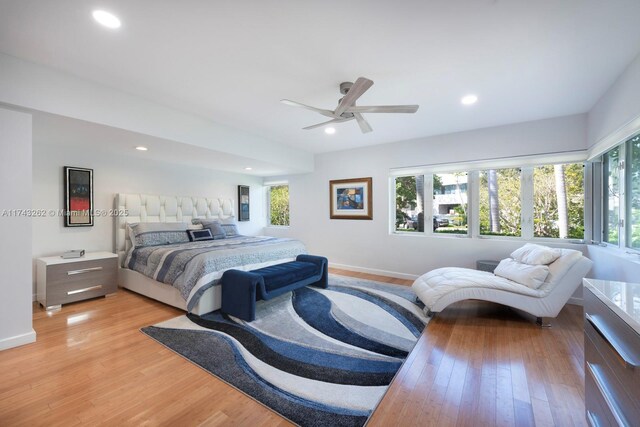 bedroom featuring recessed lighting, baseboards, ceiling fan, and light wood-style floors