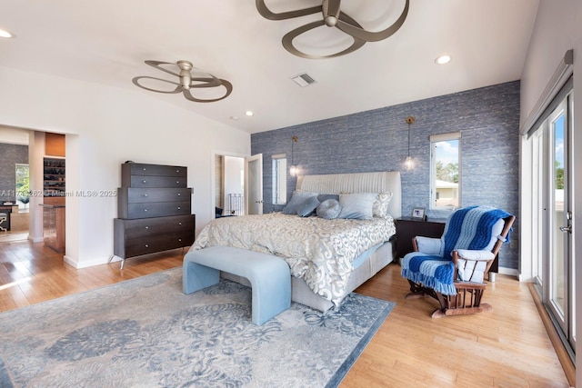 1500 NE 103rd St, Miami Shores, FL 33138 - bedroom with multiple windows, light wood-style floors, lofted ceiling, recessed lighting, and baseboards