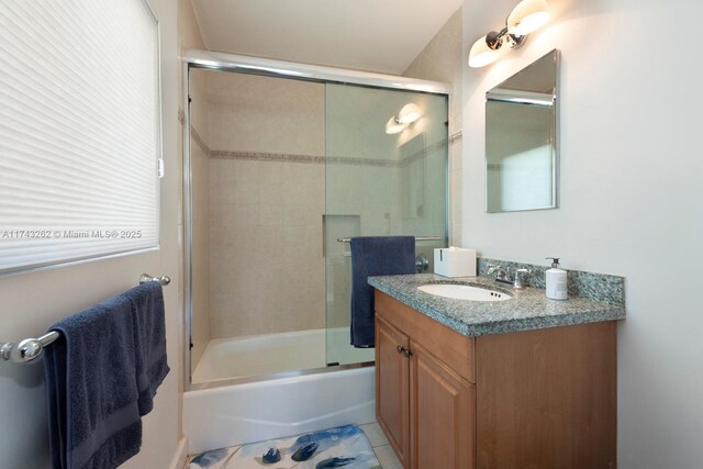 1500 NE 103rd St, Miami Shores, FL 33138 - bathroom with vanity and bath / shower combo with glass door