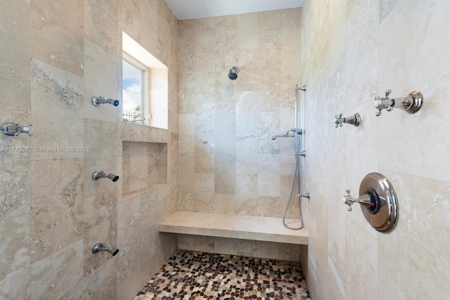 full bath featuring tiled shower