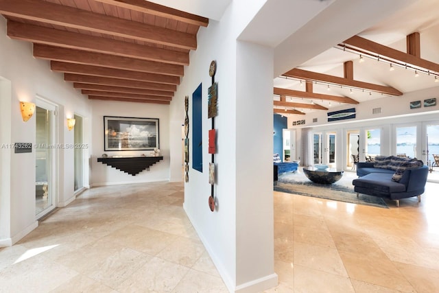 1500 NE 103rd St, Miami Shores, FL 33138 - corridor featuring beamed ceiling, baseboards, wood ceiling, light tile patterned flooring, and track lighting
