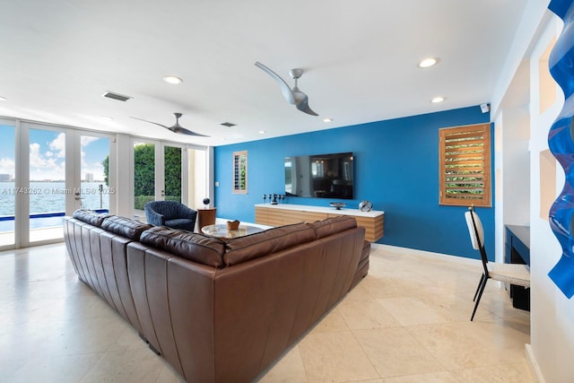 1500 NE 103rd St, Miami Shores, FL 33138 - living room featuring french doors, recessed lighting, ceiling fan, baseboards, and a water view