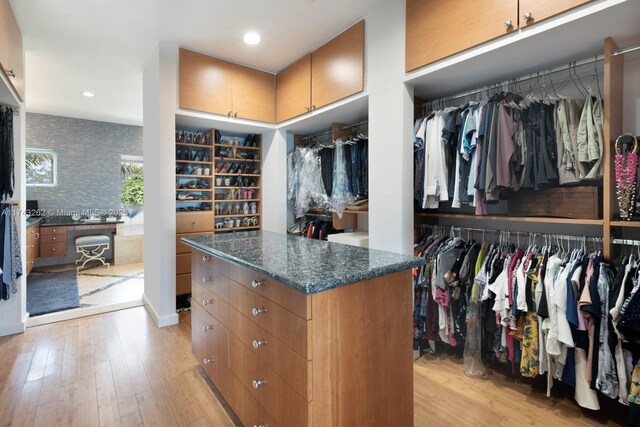 spacious closet with light wood-style floors