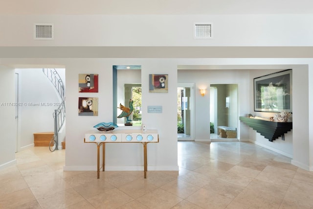 1500 NE 103rd St, Miami Shores, FL 33138 - hallway with stairs, baseboards, and light tile patterned flooring