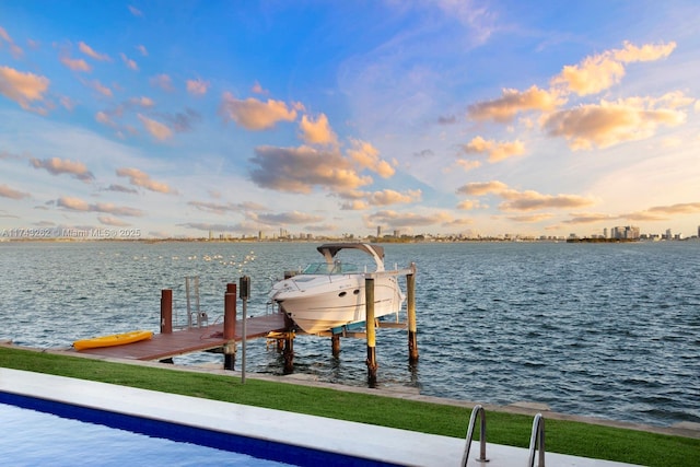 view of dock with boat lift and a water view