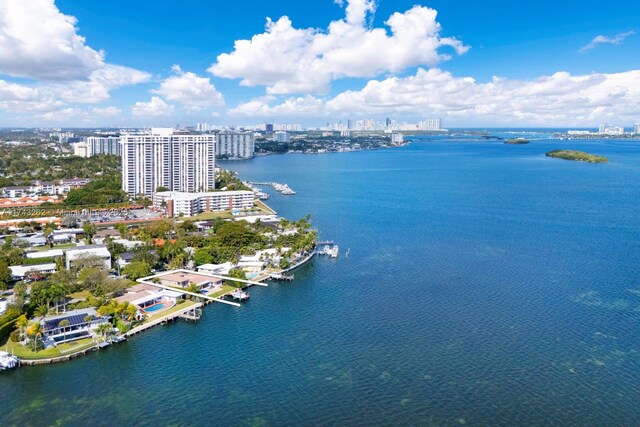 birds eye view of property featuring a view of city and a water view