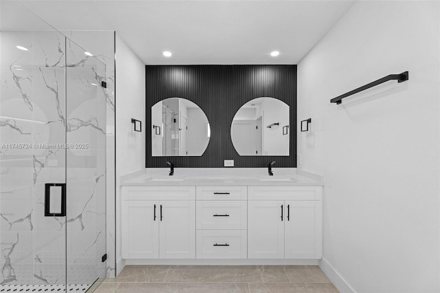 bathroom with vanity and a shower with shower door