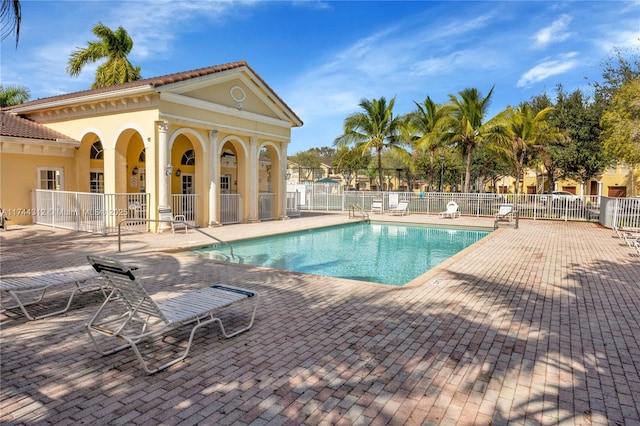 view of swimming pool with a patio area