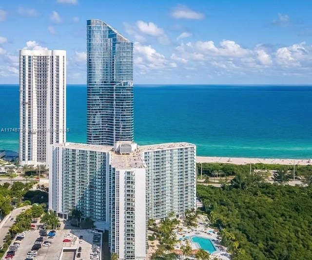 bird's eye view with a view of the beach and a water view