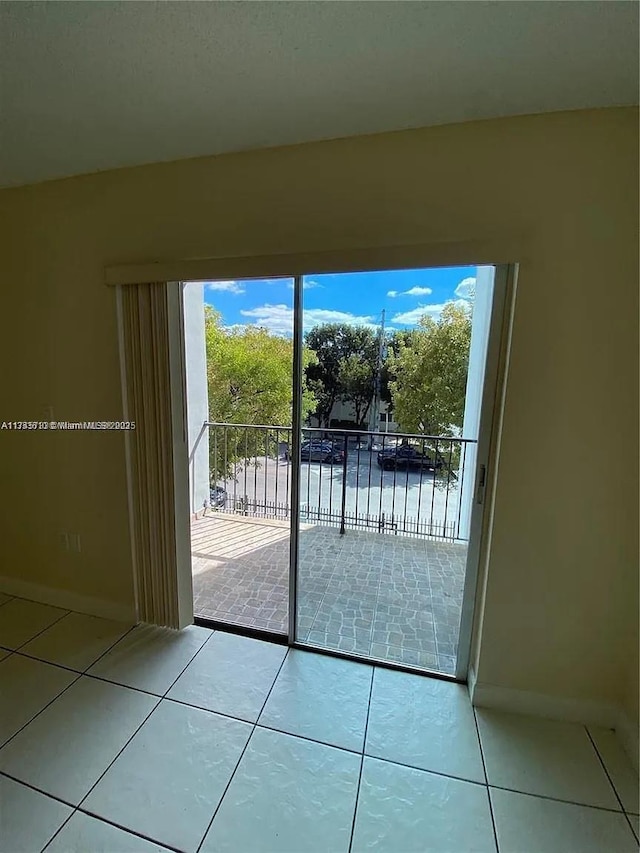 entryway with light tile patterned floors