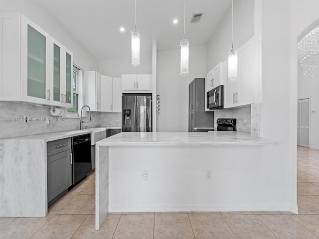 kitchen with pendant lighting, dishwasher, white cabinetry, electric range oven, and fridge with ice dispenser