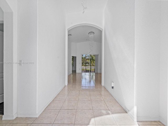 hallway featuring light tile patterned floors