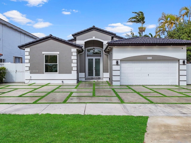 view of front facade featuring french doors and a garage