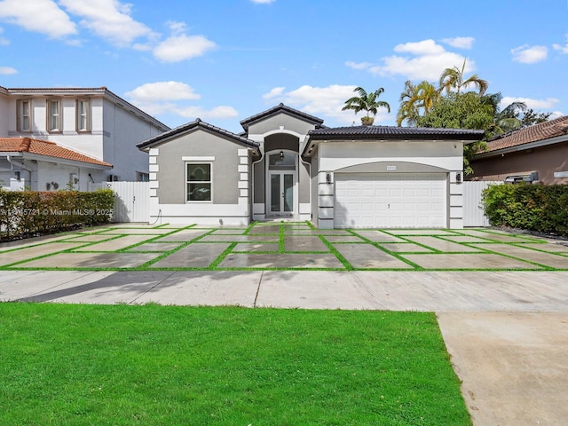 mediterranean / spanish-style home featuring a garage