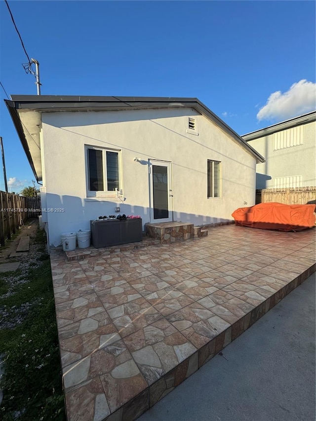 rear view of house with a patio