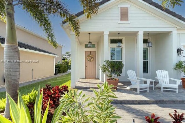 doorway to property featuring a porch