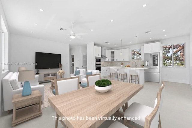 dining space with a ceiling fan, visible vents, and recessed lighting