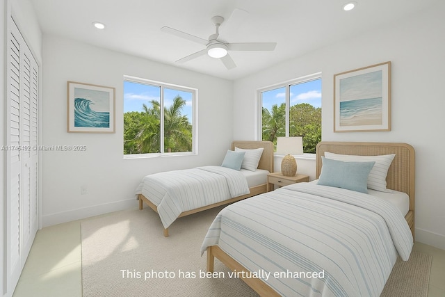 bedroom featuring recessed lighting, baseboards, and multiple windows