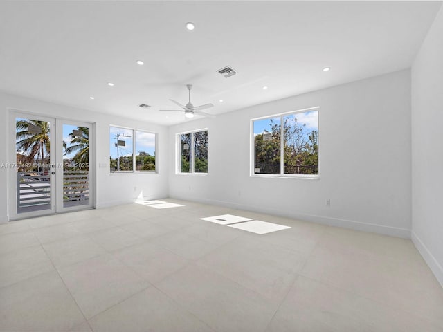 unfurnished living room featuring recessed lighting, visible vents, and baseboards