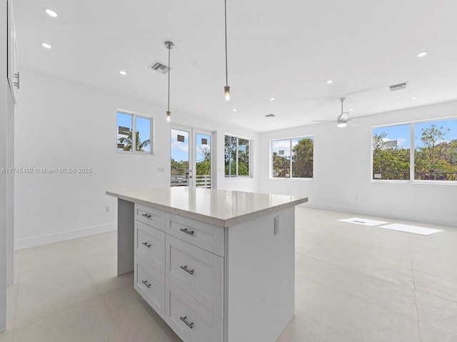 kitchen featuring visible vents, light tile patterned floors, and french doors