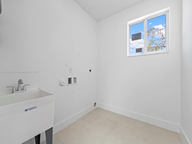 clothes washing area featuring a sink, electric dryer hookup, baseboards, laundry area, and washer hookup