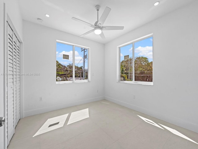 unfurnished bedroom with recessed lighting, a ceiling fan, baseboards, and light tile patterned floors