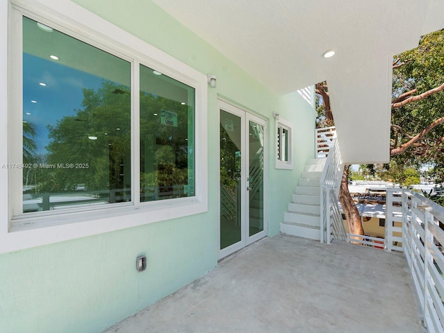 view of patio / terrace with french doors and stairs