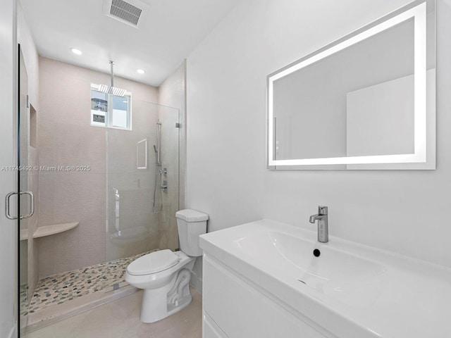 bathroom with a stall shower, vanity, toilet, visible vents, and recessed lighting