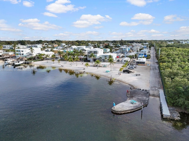 birds eye view of property featuring a residential view and a water view