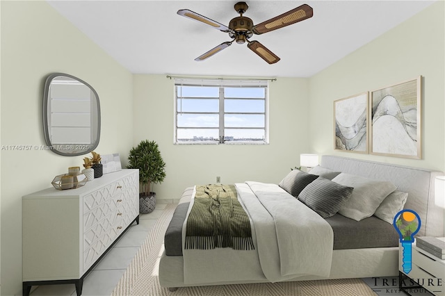 tiled bedroom featuring ceiling fan