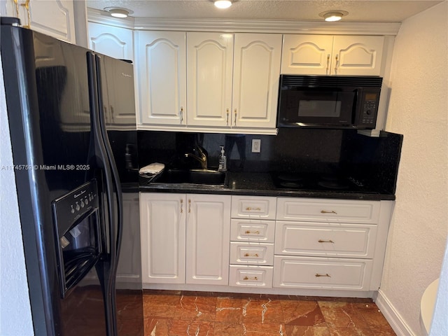 kitchen featuring sink, white cabinets, and black appliances