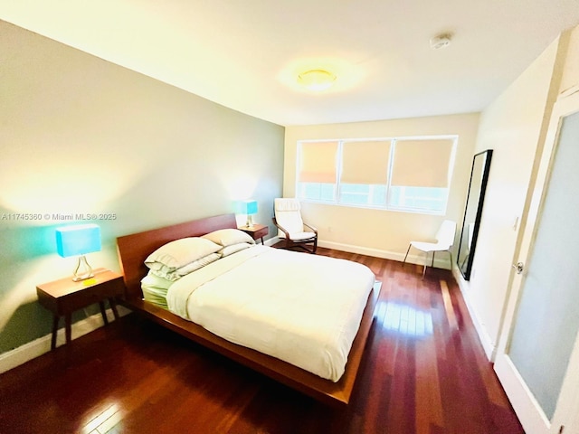 bedroom featuring dark wood-type flooring