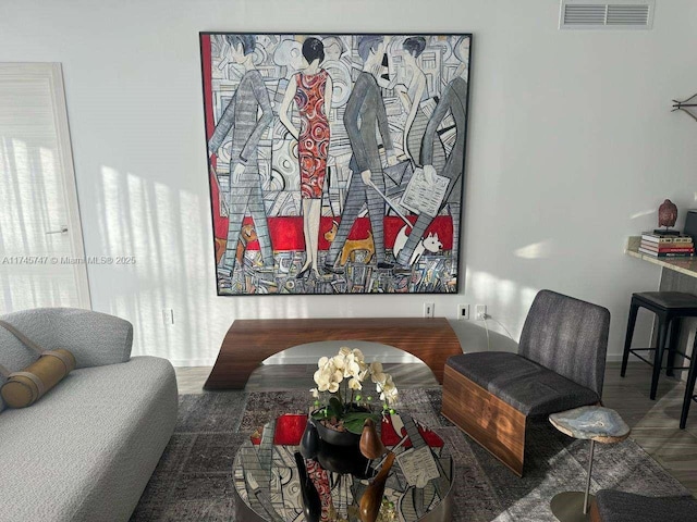 sitting room featuring hardwood / wood-style flooring