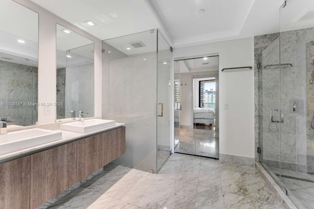 bathroom with vanity and an enclosed shower