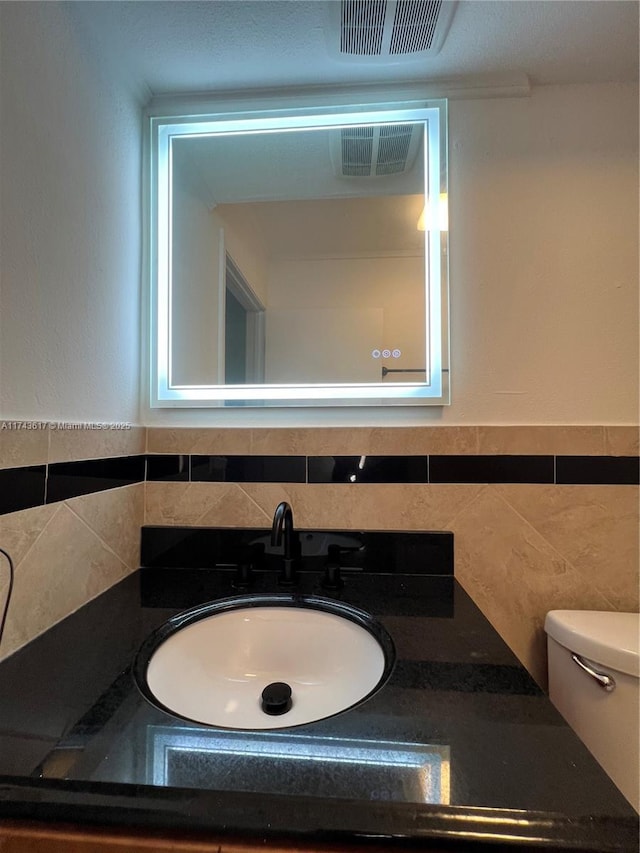 bathroom with toilet and sink