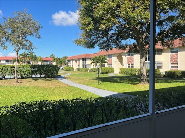 view of community featuring a yard