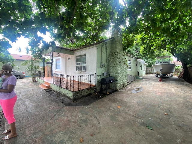 view of front facade featuring cooling unit